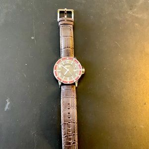 DNKY watch gray with red stones around bezel